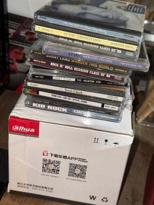 D32-small TV, radio, CDs, and CD case