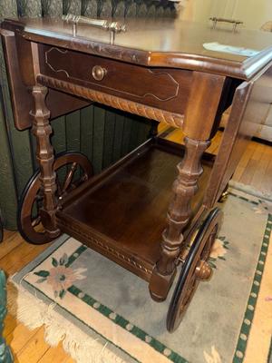 Sale Photo Thumbnail #907: M34-wooden cart and rug

29 inches tall
34 inches long
Fully extended 36 inches
Drop leaves down, 18 inch width