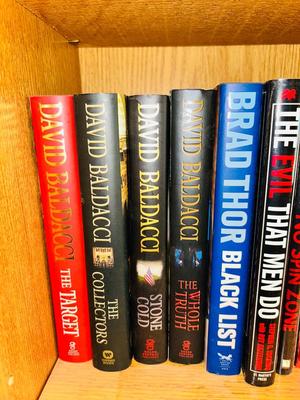 A COLLECTION OF CLIVE CUSSLER, DAVID BALDACCI AND OTHER HARD BACK NOVELS