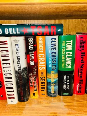 NOVELS INCLUDING TOM CLANCY, CLIVE CLUSTER, MICHAEL CRICHTON AND MORE