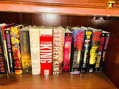 A HORRIFYING YET DELIGHTFULLY LARGE ASSORTMENT OF STEVEN KING AND DEAN KOONTZ BOOKS