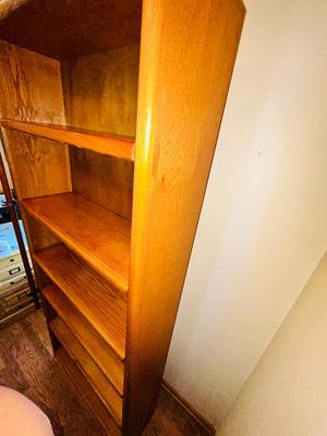 A LARGE OAK BOOKCASE WITH FLAG POLE