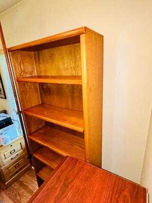 A LARGE OAK BOOKCASE WITH FLAG POLE