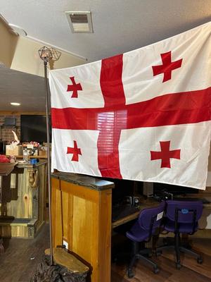 CHUNK OF WOOD WITH LIGHTED FLAG POLE AND FLAG