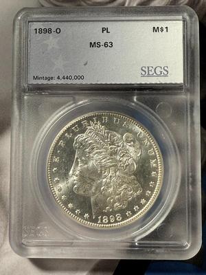 SEGS CERTIFIED 1898-O MS63 PROOF-LIKE MORGAN SILVER DOLLAR AS PICTURED.