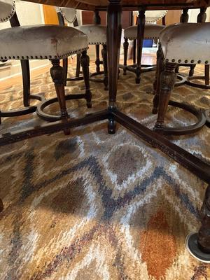 Beautiful dining room table with six leather chairs