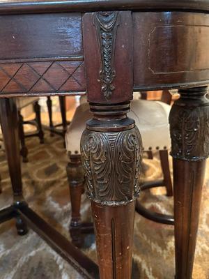 Beautiful dining room table with six leather chairs