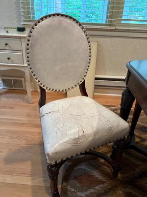 Beautiful dining room table with six leather chairs