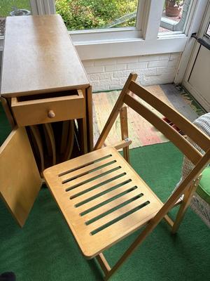 Wood drop down table with four chairs