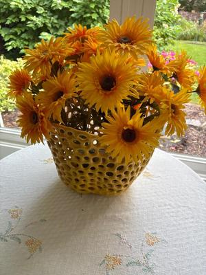 Yellow pot with sunflowers