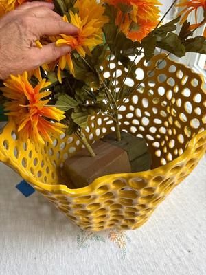 Yellow pot with sunflowers