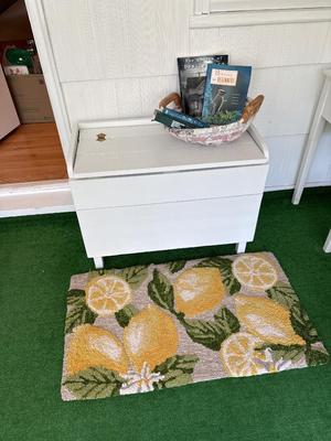 Bench, rug, basket & books