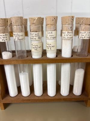 Test tube is showing sugar content of various items