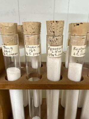 Test tube is showing sugar content of various items