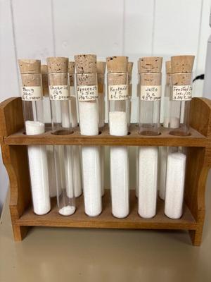 Test tube is showing sugar content of various items