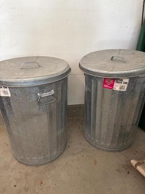 Two metal trash cans