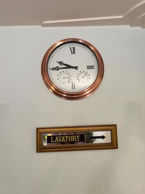 COPPER FRAMED WALL CLOCK AND LAVATORY SIGN