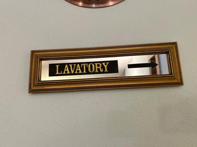 COPPER FRAMED WALL CLOCK AND LAVATORY SIGN