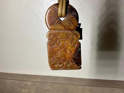 Native Am style bolo tie w/jade stone, Chinese jade pendant w/bi disc and carved pattern.