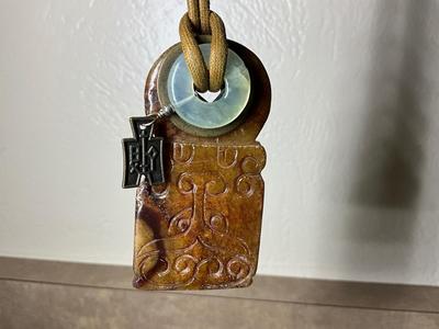 Native Am style bolo tie w/jade stone, Chinese jade pendant w/bi disc and carved pattern.