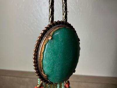Native Am style bolo tie w/jade stone, Chinese jade pendant w/bi disc and carved pattern.