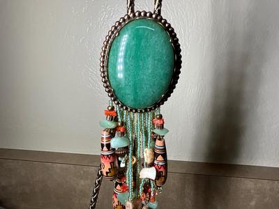 Native Am style bolo tie w/jade stone, Chinese jade pendant w/bi disc and carved pattern.