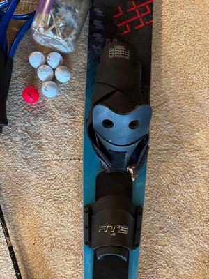 Sale Photo Thumbnail #563: Fishing poles, tennis rackets, solid ski, golf balls, and tees