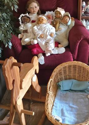 LOT 49L: Multiple Dolls with Makers Marks, Wicker Bassinet, and Wooden Rocking Horse