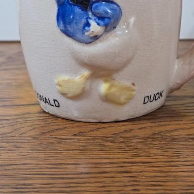 LOT 54D: The Art of Disney Book, Donald Duck Mug, Miniature Mickey Mouse Figure, Disney World Trinket Tray, Mickey Conductor Music Box,...