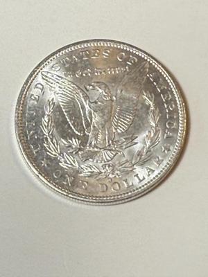 1904-O UNCIRCULATED CONDITION MORGAN SILVER DOLLAR (COIN #5X4) AS PICTURED.
