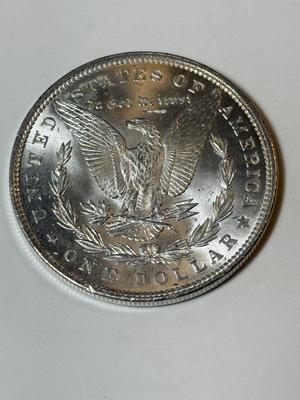 1889 UNCIRCULATED CONDITION MORGAN SILVER DOLLAR (COIN #6X4) AS PICTURED.