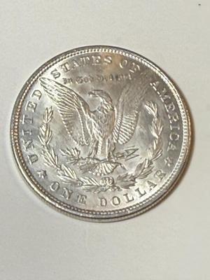 1880 UNCIRCULATED CONDITION CLEANED REVERSE MORGAN SILVER DOLLAR (COIN #7X4) AS PICTURED.