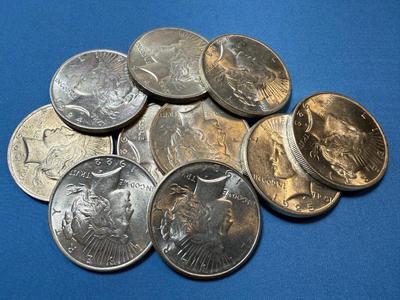 BAG #2 OF 10 DECENT SHAPE PEACE SILVER DOLLARS AT MELT SILVER PRICE AS PICTURED. (RECEIVE ALL COINS PICTURED).