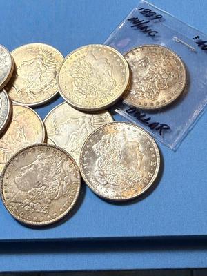 BAG #4 OF 10 DECENT SHAPE MORGAN & PEACE SILVER DOLLARS AT MELT SILVER PRICE AS PICTURED. (RECEIVE ALL COINS PICTURED).