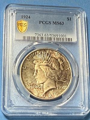 PCGS CERTIFIED 1924 MS63 TONED PEACE SILVER DOLLAR AS PICTURED.