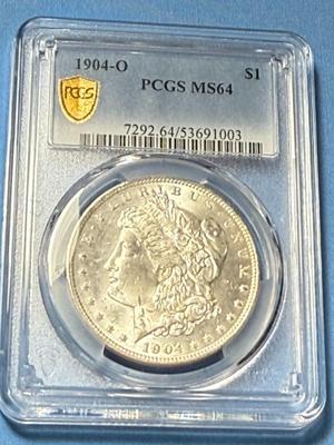 PCGS CERTIFIED 1904-O MS64 MORGAN SILVER DOLLAR AS PICTURED.