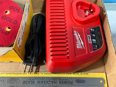 Milwaukee charger, Hacksaw blades, sander paper, Anchors for the car tires