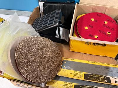 Milwaukee charger, Hacksaw blades, sander paper, Anchors for the car tires