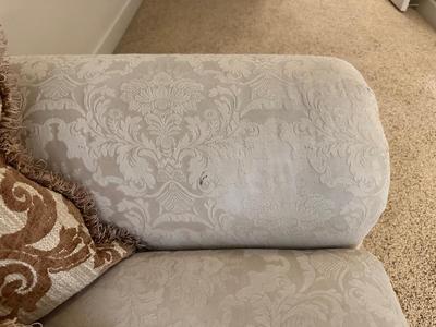 CREAM COLORED LOVESEAT WITH THROW PILLOWS