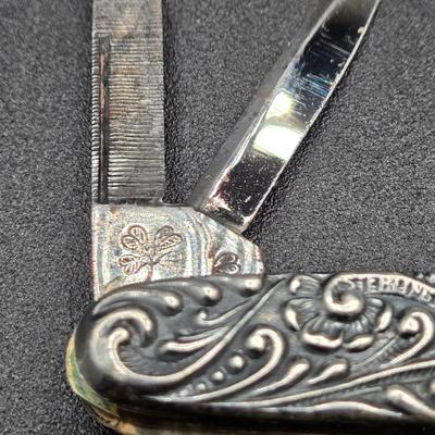 LOT 22J: Two Pairs of Antique Rimless Eyeglasses in Cases, WH Morley & Sons Pocket Knife with Case, Tiny Book Locket, and More