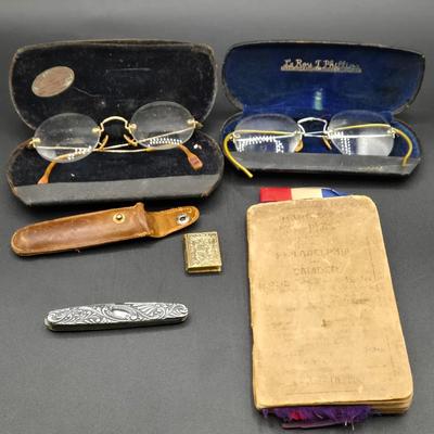 LOT 22J: Two Pairs of Antique Rimless Eyeglasses in Cases, WH Morley & Sons Pocket Knife with Case, Tiny Book Locket, and More