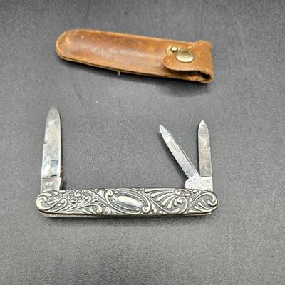 LOT 22J: Two Pairs of Antique Rimless Eyeglasses in Cases, WH Morley & Sons Pocket Knife with Case, Tiny Book Locket, and More