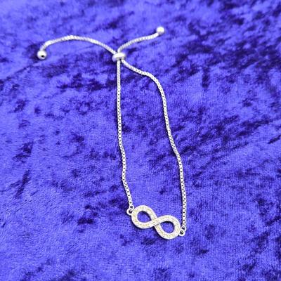LOT 29J: Sterling Silver and Diamond Adjustable Infinity Bracelet