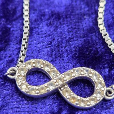 LOT 29J: Sterling Silver and Diamond Adjustable Infinity Bracelet