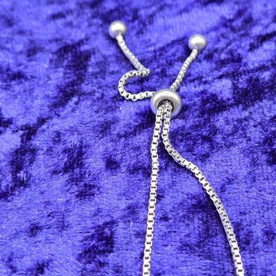 LOT 29J: Sterling Silver and Diamond Adjustable Infinity Bracelet