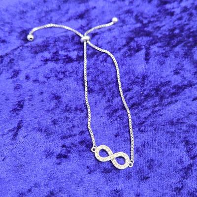 LOT 29J: Sterling Silver and Diamond Adjustable Infinity Bracelet