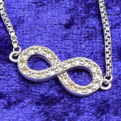 LOT 29J: Sterling Silver and Diamond Adjustable Infinity Bracelet