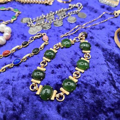 LOT 57J: Multiple Bracelets Including Sarah Coventry, Ten Commandments Charm Bracelet, Trifari Necklace, and More