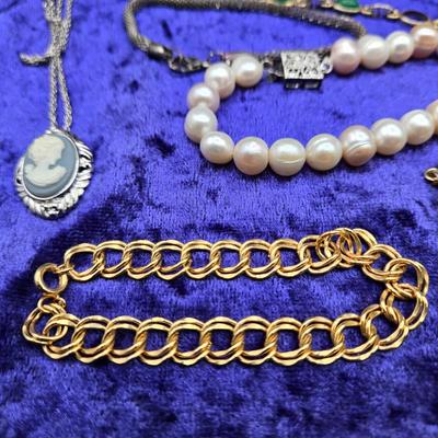 LOT 57J: Multiple Bracelets Including Sarah Coventry, Ten Commandments Charm Bracelet, Trifari Necklace, and More
