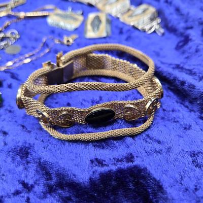 LOT 57J: Multiple Bracelets Including Sarah Coventry, Ten Commandments Charm Bracelet, Trifari Necklace, and More